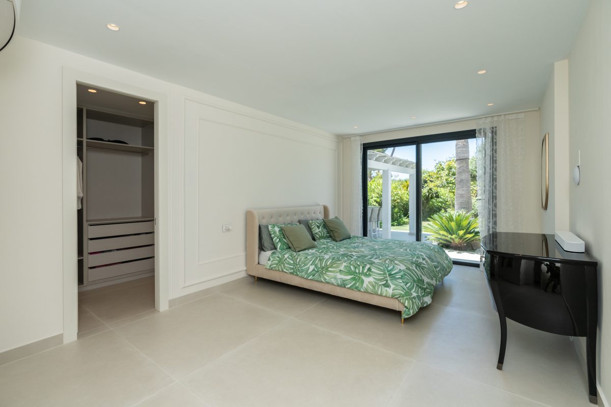 Bedroom with dressing area and garden view
